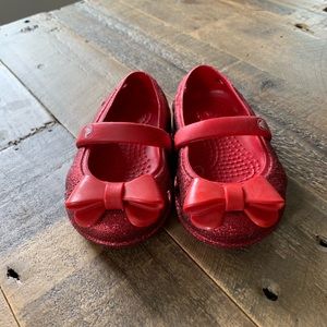 Red sparkly crocs size 4